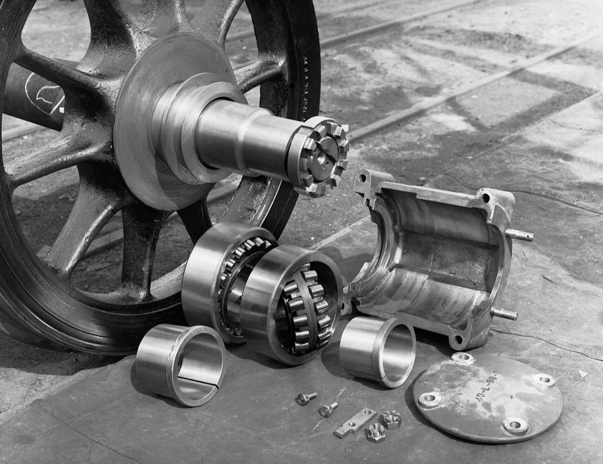 Railway axle and wheel with dismantled bearing, bushes and housing